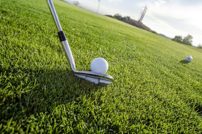 Golfer putting on Getty Golf green